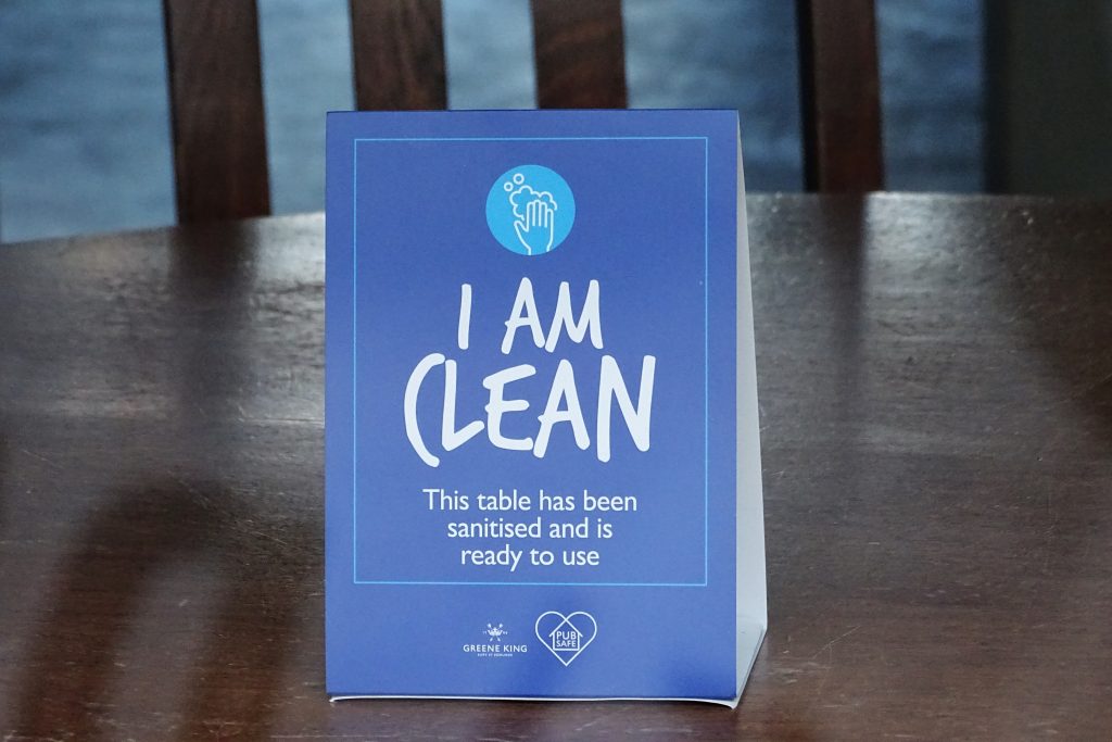 A picture of a company keeping their tables clean