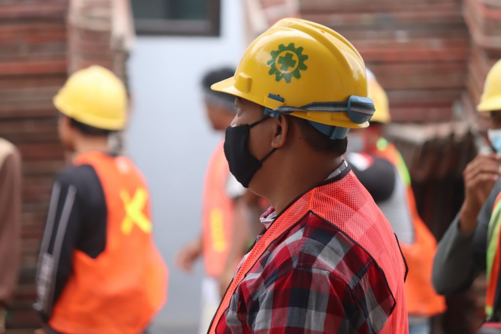 worker in hard hat and safety vest