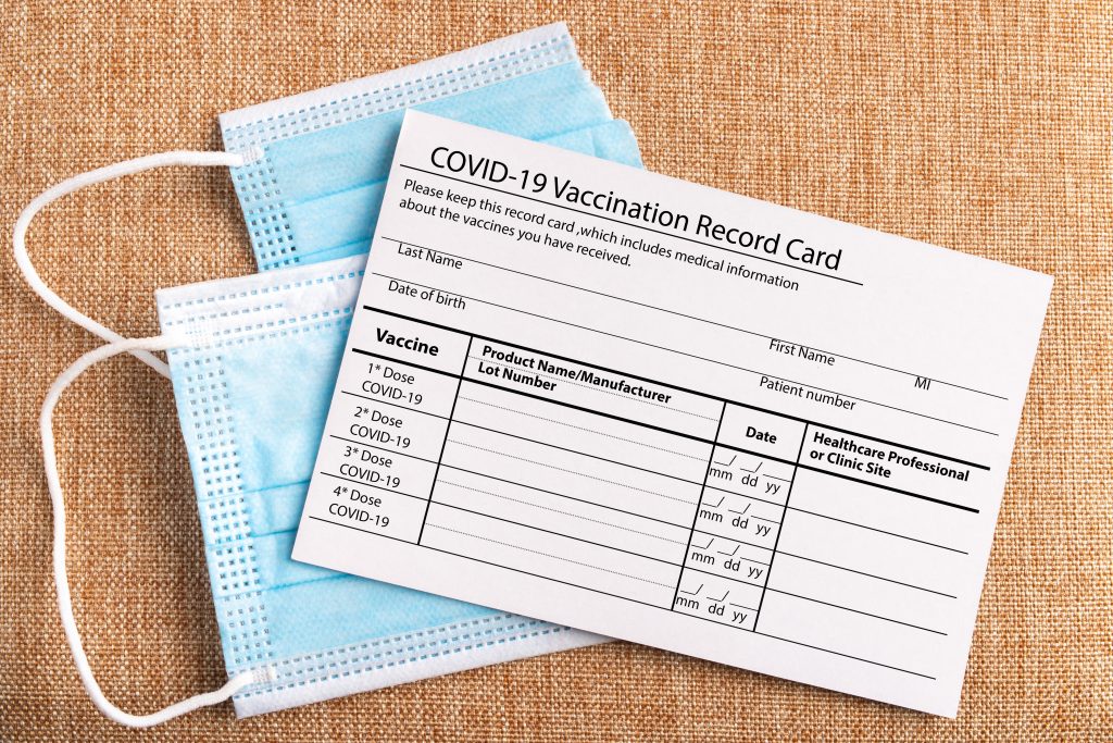 masks and covid-19 vaccination record card