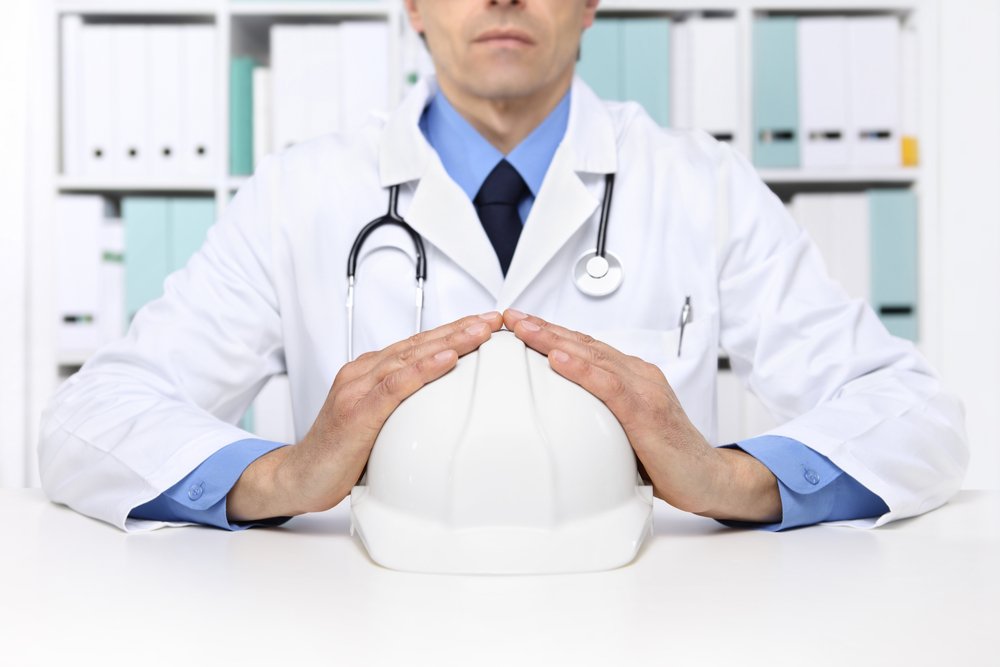 occupational health doctor with hardhat