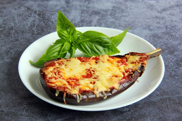 baked-stuffed-eggplant-with-mozzarella-cheese-tomato-sauce-plate-grey-background_770553-18