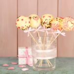 tasty-cake-pops-gift-wooden-background_392895-80184